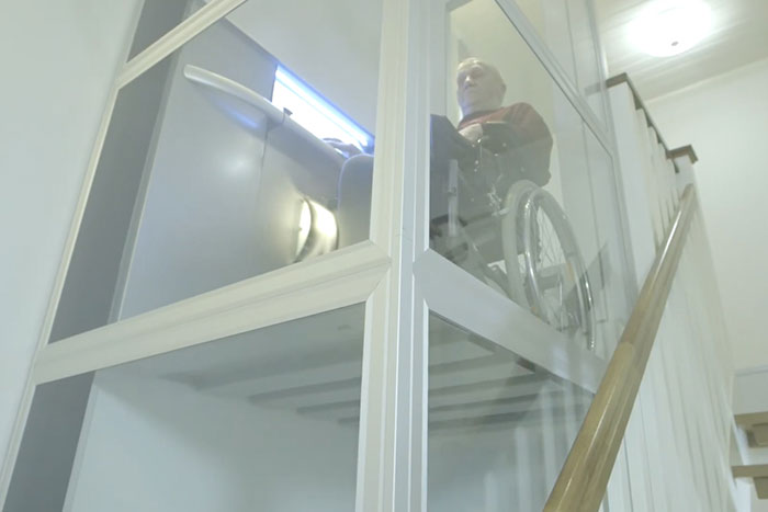 wheelchair user in cibes lift